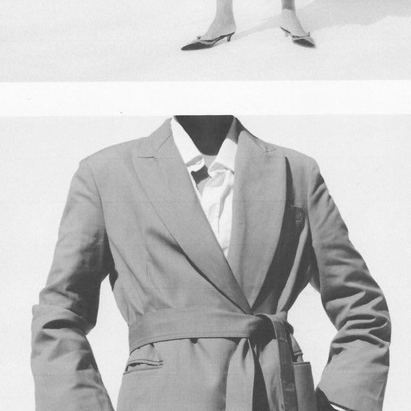 model wearing brown sheer skirt and a leather coat with white shearling detail